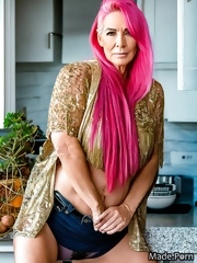 Old slut in shorts caresses her cunt in anticipation of a good fuck in the evening