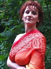 Voluptuous old mom is playing alone